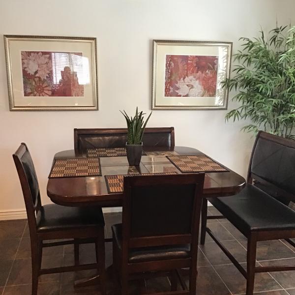 Photo of Kitchen/dining table with chairs and benches