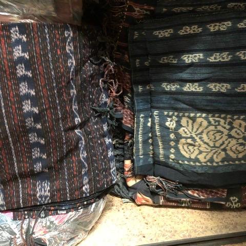 Photo of Indonesia’s woven ceremonial pieces, runners , loops, sarongs .