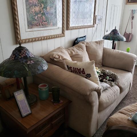 Photo of Overstuffed Couch and two solid wood Ashley end tables