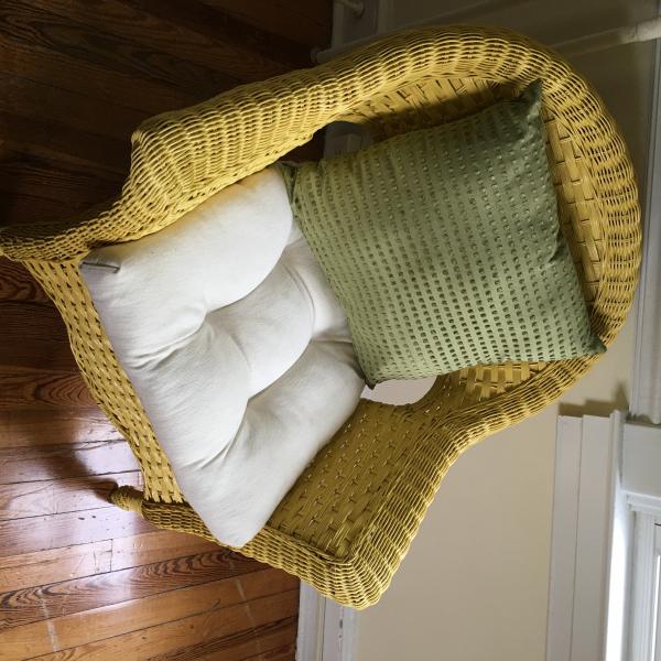 Photo of Wicker chair with cushion