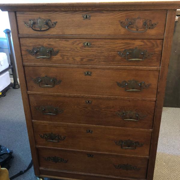 Photo of Antique solid oak dresser with dovetail  and brass handles and wheels