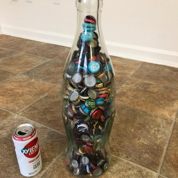 Photo of Coke bottle full of bottlecaps