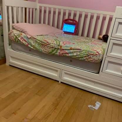 Photo of white crib/Trundle bed with shelves and drawers