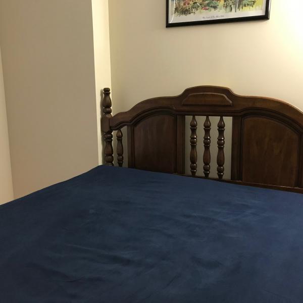 Photo of Queen bed and solid wood headboard