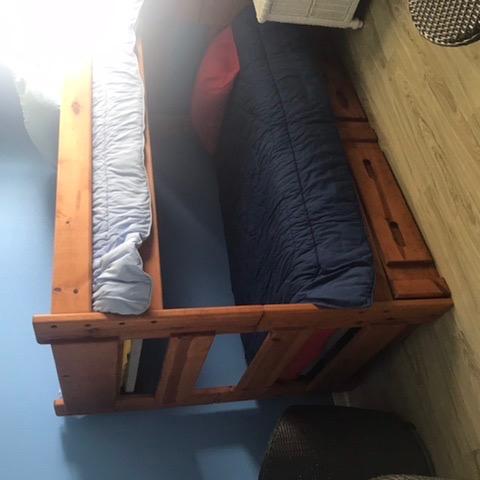 Photo of 2 set of solid wood bunk beds with two drawers in the bottom