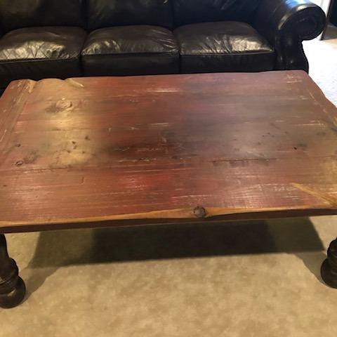 Photo of Solid Wood Coffee Table with tints of red on top