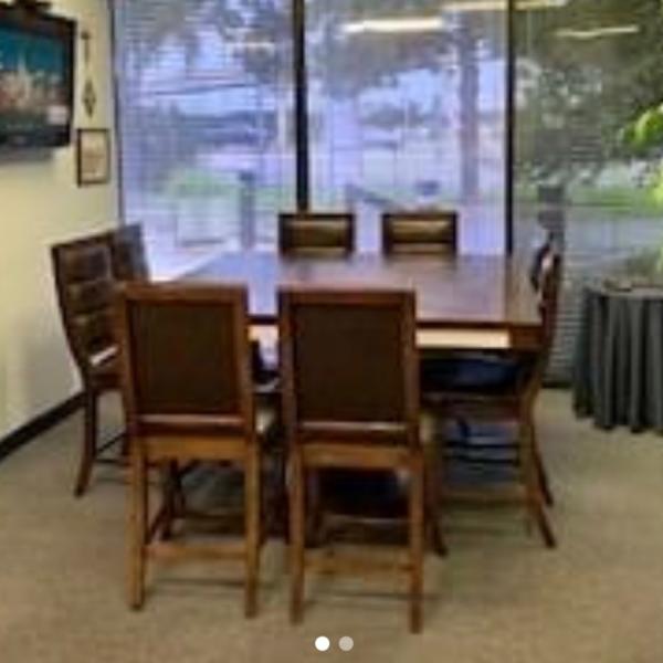 Photo of Table and leather top chairs