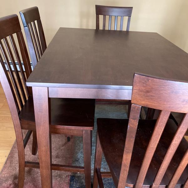 Photo of  Wood pub table with six chairs