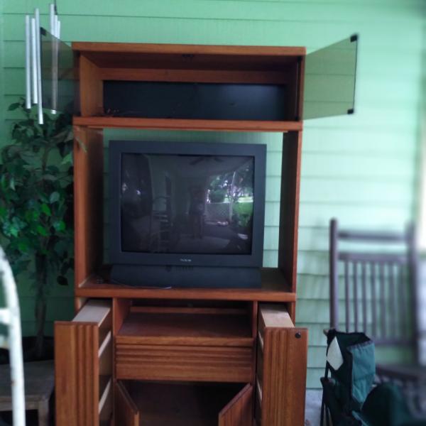 Photo of Oak entertainment center with 32 inch tv