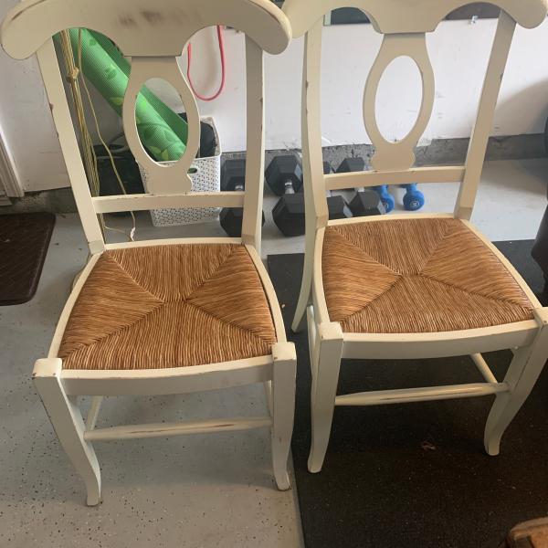 Photo of Two white pottery barn chairs