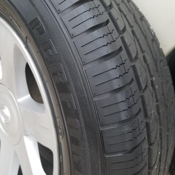 Photo of Car Rims with Full Size Spare Tire 