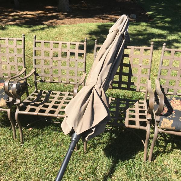 Photo of patio chairs & table umbrella