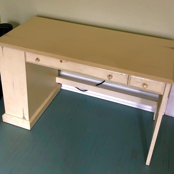 Photo of Cream colored desk