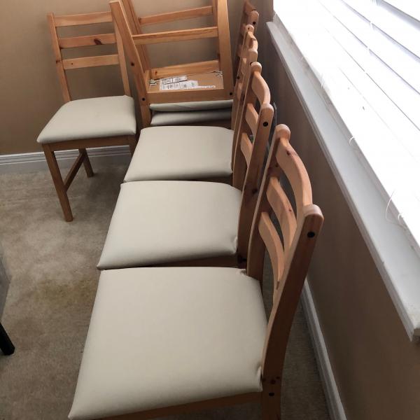 Photo of 6 IKEA off white chairs  with light color wood