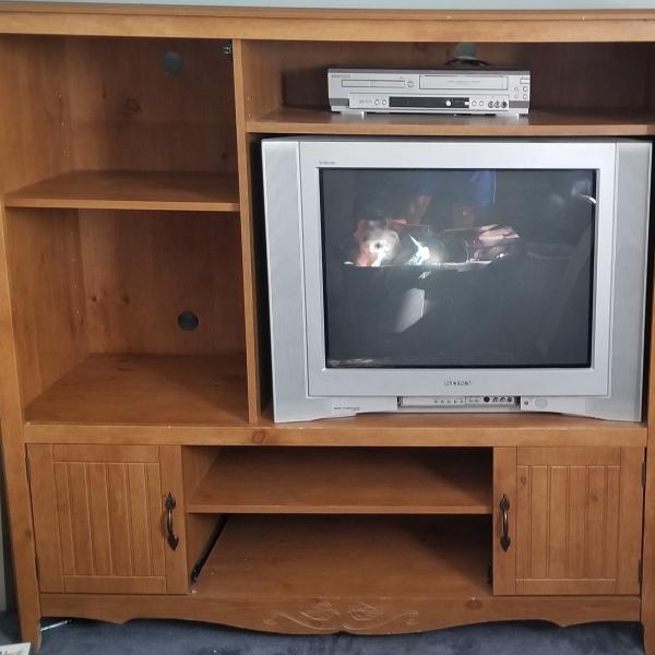 Photo of Tv stand with tv and VCR