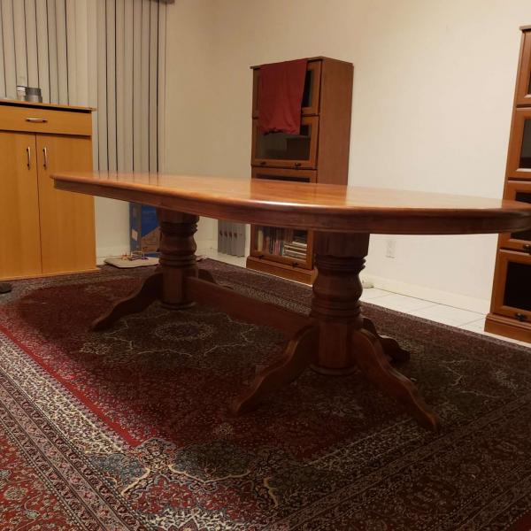 Photo of Wooden Dining table with 8 chairs  in very good condition .