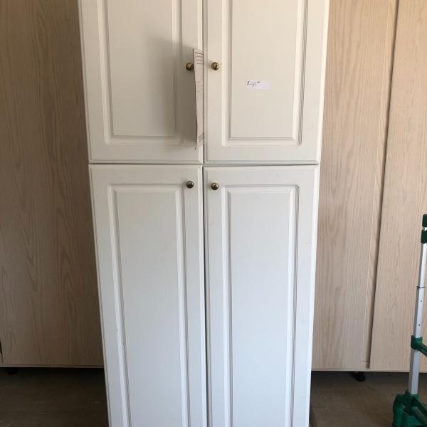 Photo of White painted wood cabinet