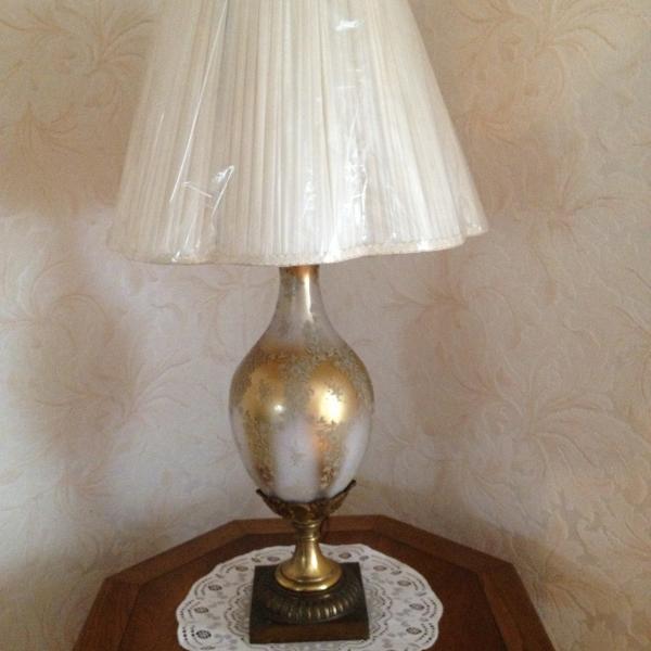 Photo of vintage glass and brass lamp