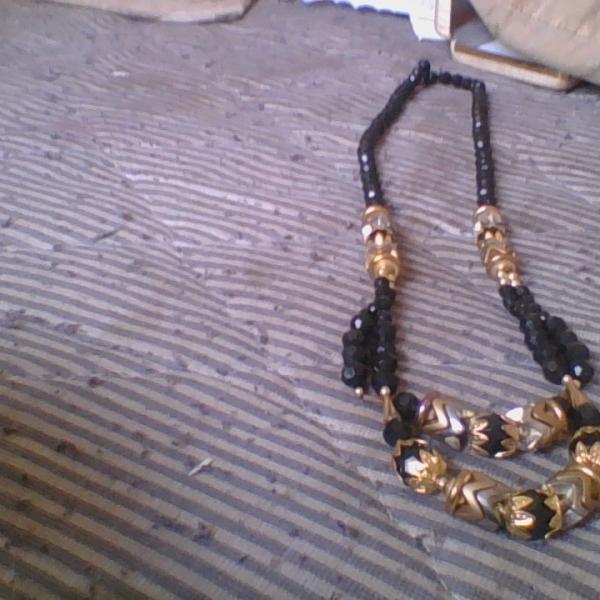 Photo of  black and gold necklace