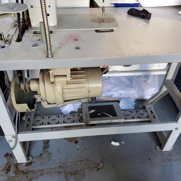 Photo of industrial sewing machine, desks, file cabinets, new product