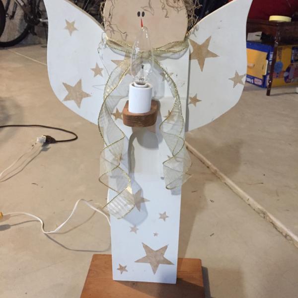 Photo of Wooden Christmas angel with candle light