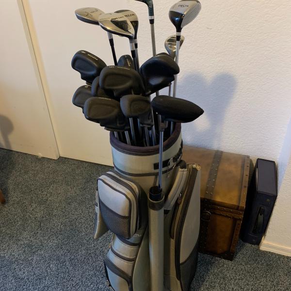 Photo of Professional Golf Clubs and Caddy