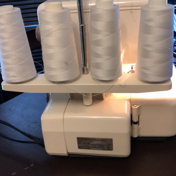 Photo of Kenmore 34 Serger sewing machine , and 2 walkers one a Drive duel  and 1  Nova