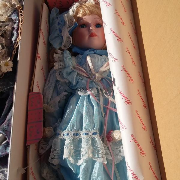 Photo of Porcelain Collector Dolls in Boxes