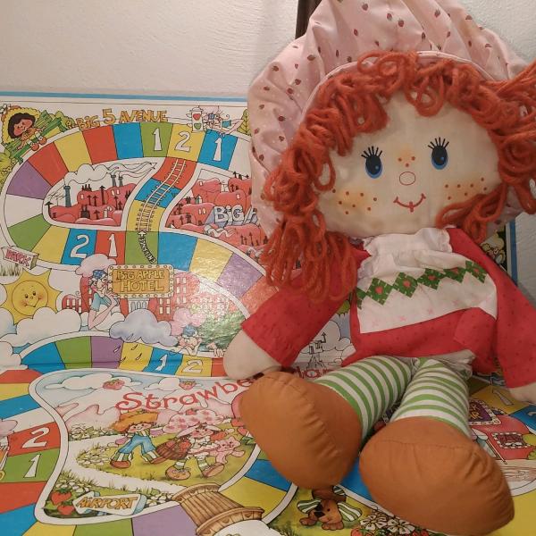 Photo of Strawberry Shortcake rag doll and game board
