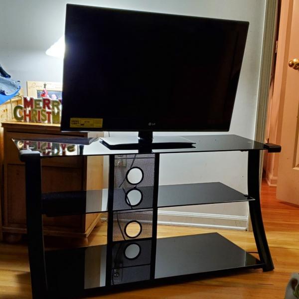 Photo of 34' Tv and glass stand for sale