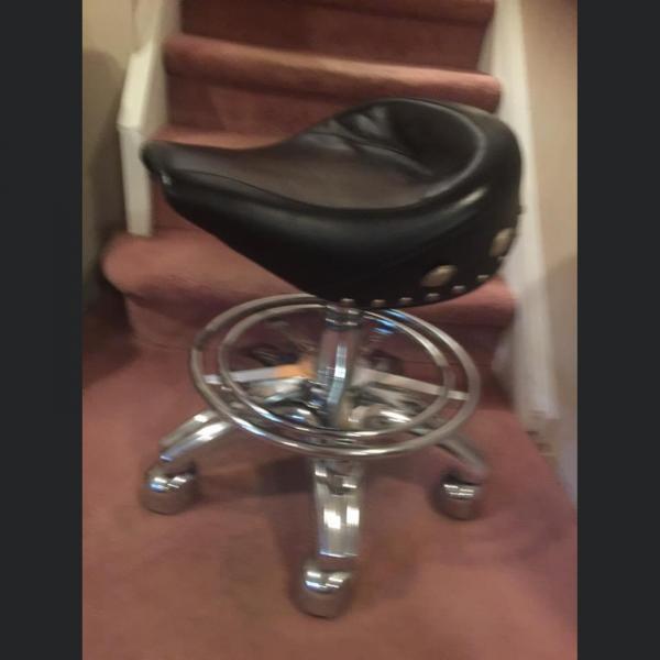 Photo of Hydraulic bar stool with adjustable height, wheels and stud design