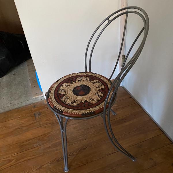 Photo of iron sturdy chair with Mexican  handmade seat topper