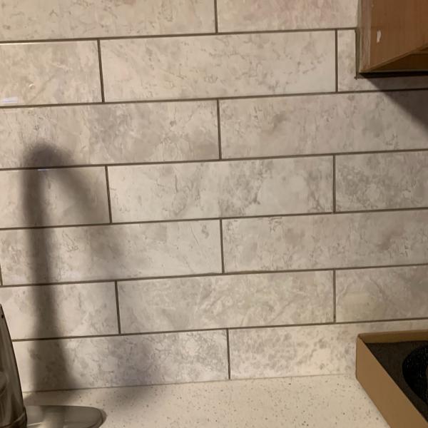 Photo of Brand new White w/gray 3x12 polished natural granite tiles.