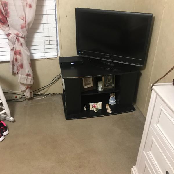 Photo of TV STAND BLACK WITH SHELVES ON ENDS