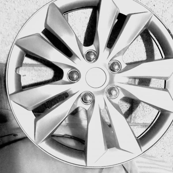 Photo of Set of four brand new  16" silver hubcaps