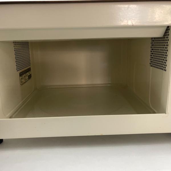 Photo of Microwave GE Model  J-E48A-002 Black with Vyinal exterior