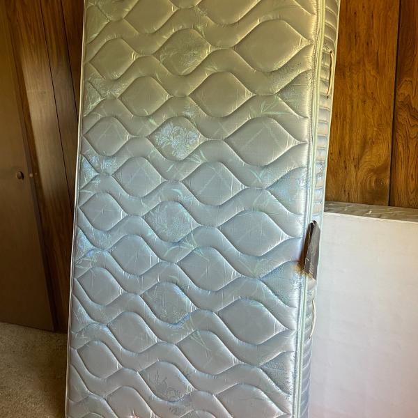 Photo of New with tags twin mattress, used box springs included 