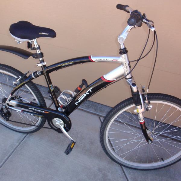 Photo of Male and Female bicycles 26 inch seven speeds. Front and rear wheel hand brakes.