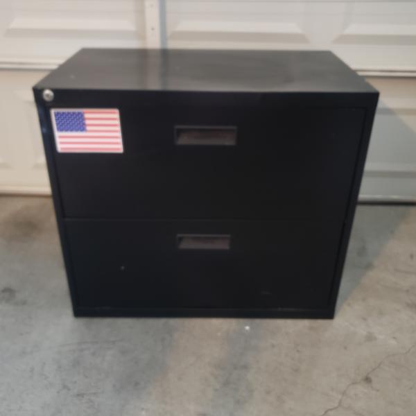 Photo of Black, steel filing cabinet.