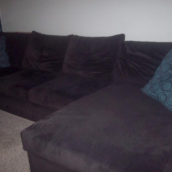 Photo of Chocolate brown sectional with over-side chase cuddler