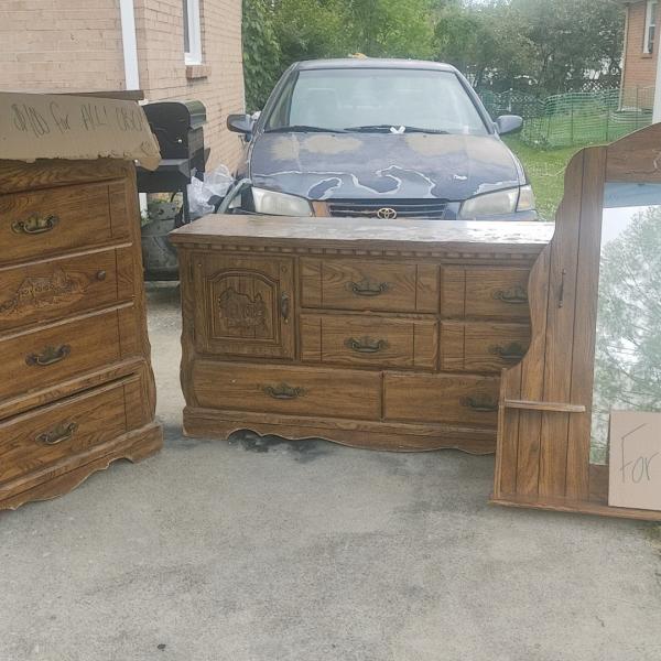 Photo of 2 matching dressers, 1 with a mirror