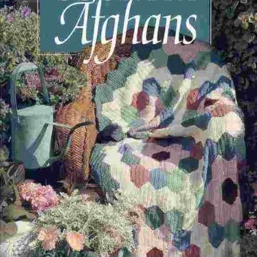 Photo of Crochet afghan pattern books, vintage Lee Wards yarn baller, yarn