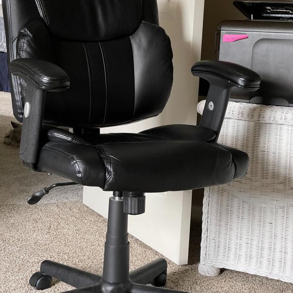 Photo of Swivel black leather office chair