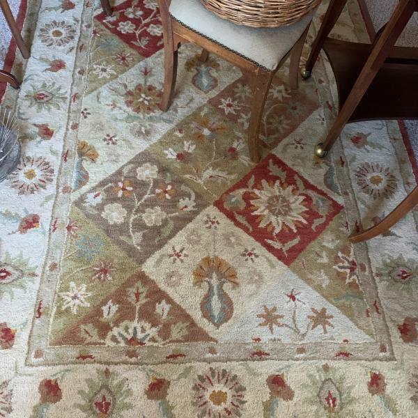 Photo of Earth toned Rug  to brighten any room!