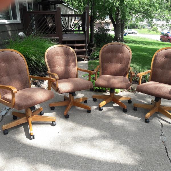Photo of 4 Oak dinette chairs on casters
