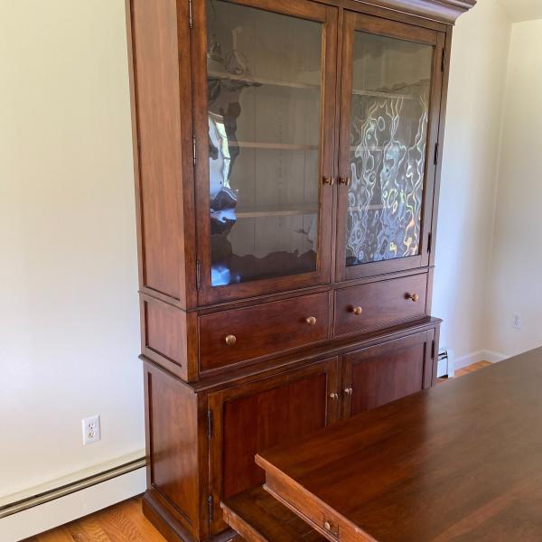 Photo of Dining Room table and a hutch 