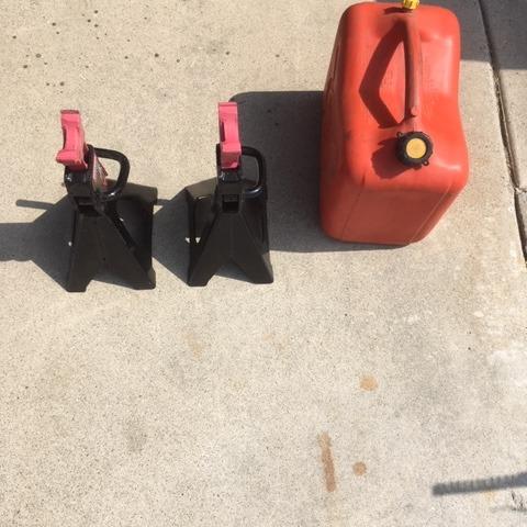 Photo of 2 car stands and gas can