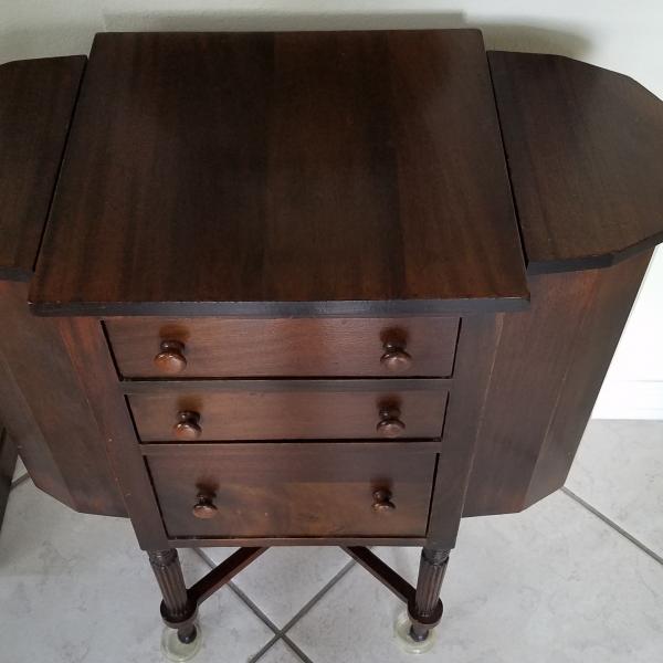 Photo of antique sewing  storage table
