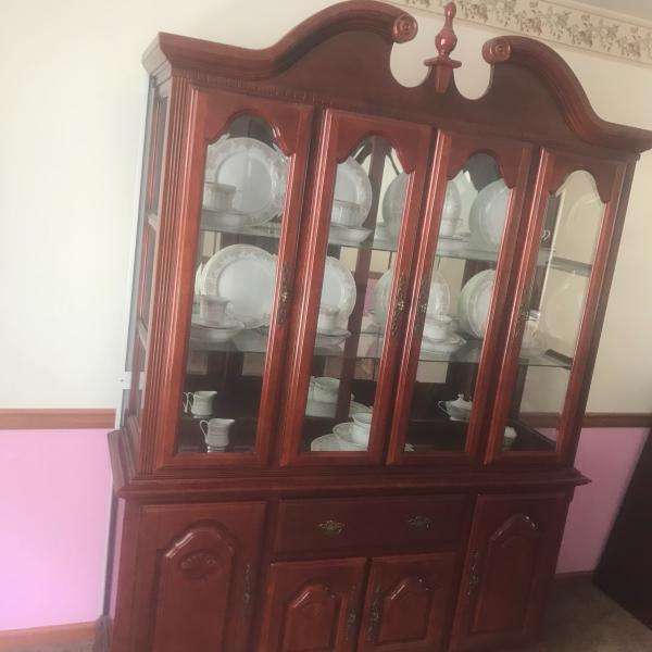 Photo of China cabinet with china