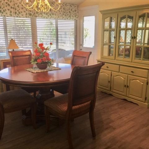 Photo of Solid wood dining room table and 4 chairs & display cabinet